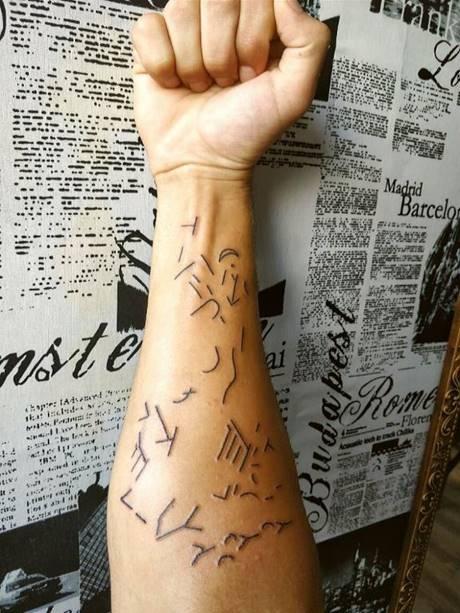 SYMBOLS FROM BLOCK K-1 AS A TATOO