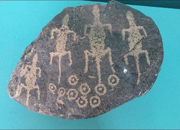 Pleiades star system. The lizard people came from the star system depicted on the stone!